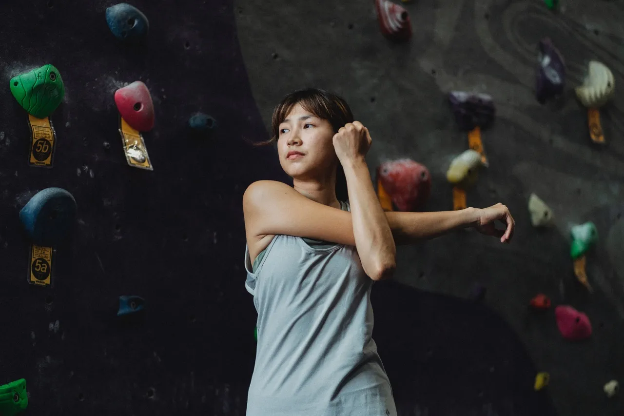 Climber stretching arms
