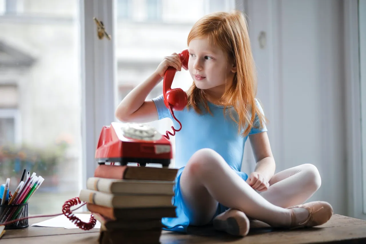 Little girl talking on phone